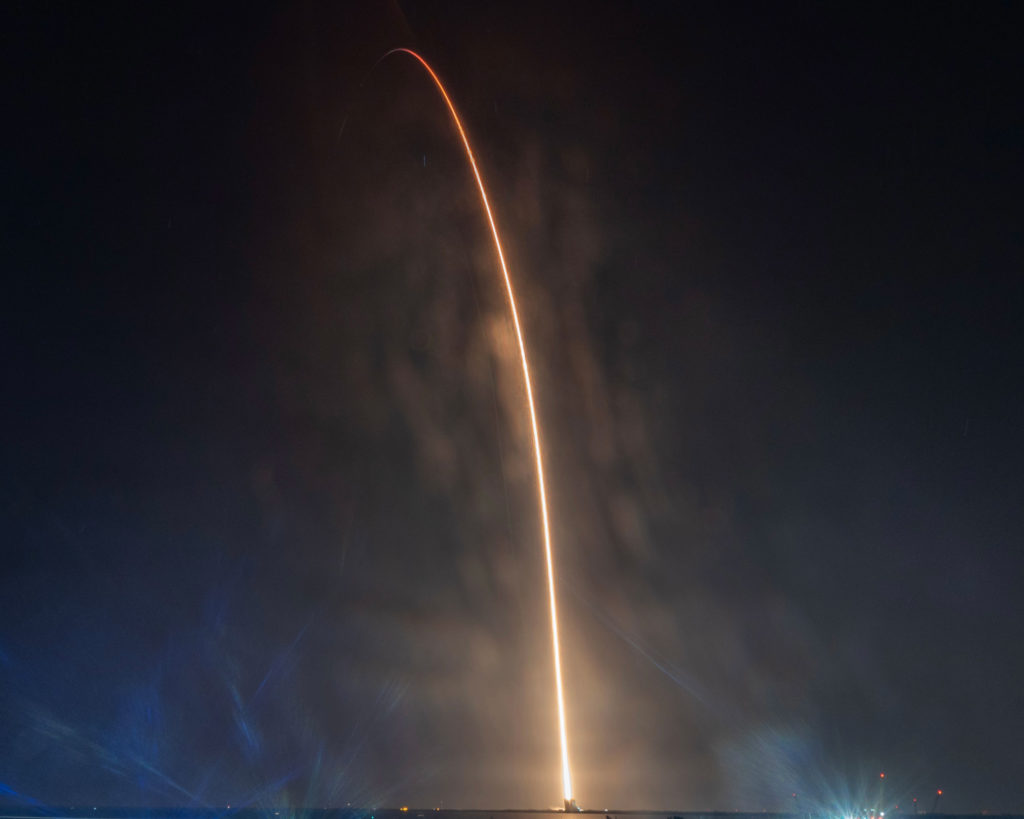 Rocket launching into space at night