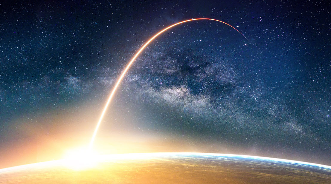 Image of a rocket shooting off earth