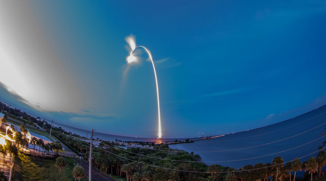 Image of a rocket shooting off earth