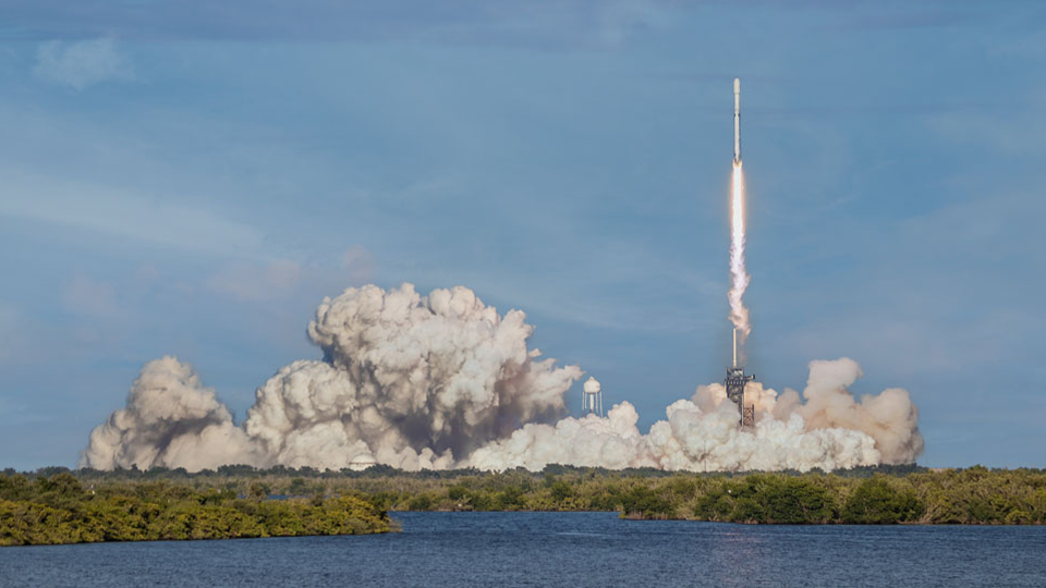 Rocket Launches From Land At A Distance