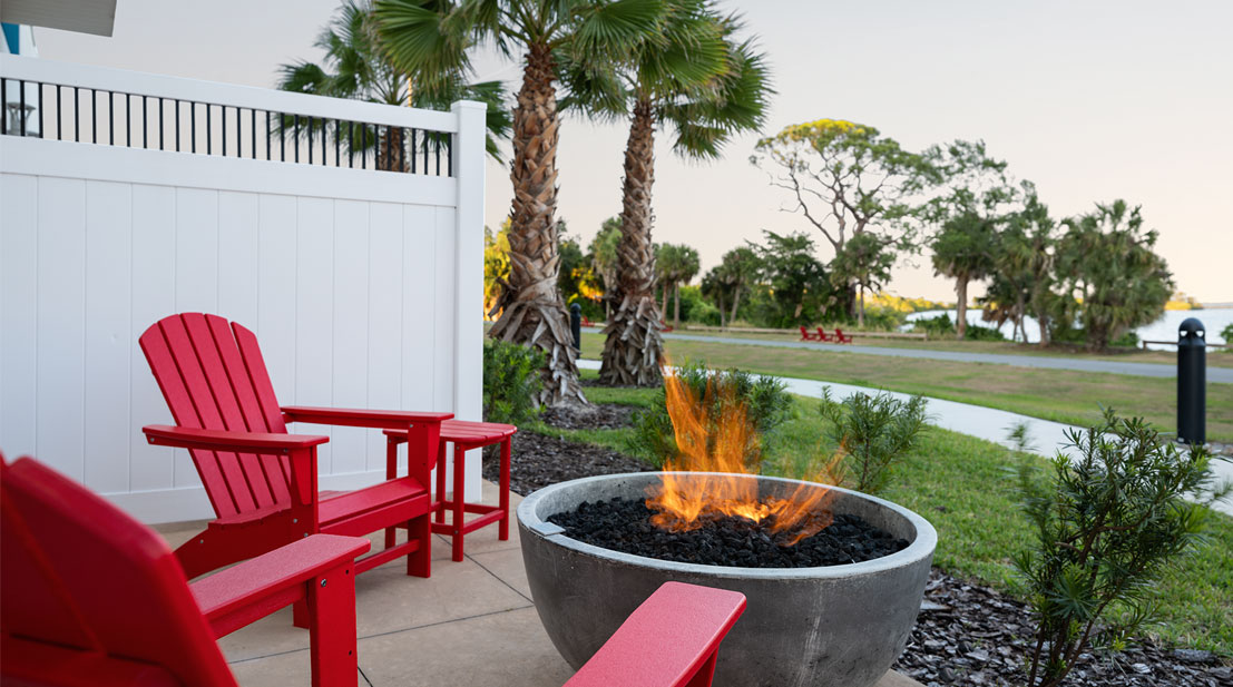 Two Red Chairs next to a Fire Pit